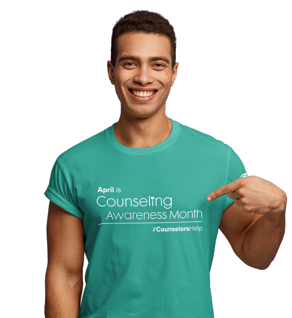 Man wearing a Counselor Awareness Month t-shirt
